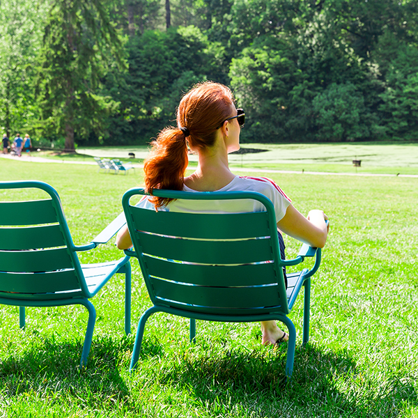Woman On Relaxing Chair Outside Square