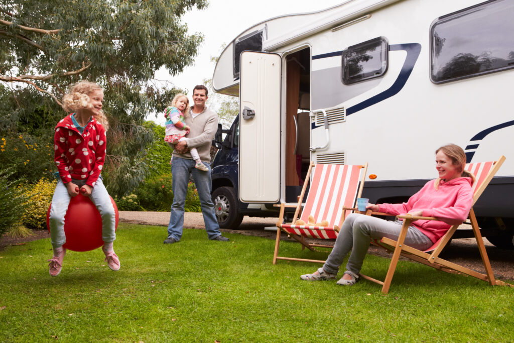 Family spending time together outside motorhome