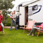 Family spending time together outside motorhome